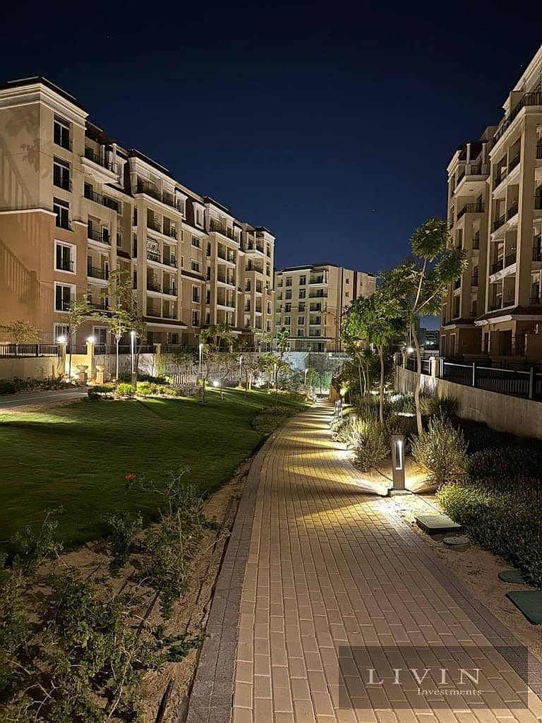 Ground floor apartment with garden for sale, two rooms, direct view of the lagoon, in installments, in Sarai Compound, in the heart of Mostakbal City 1