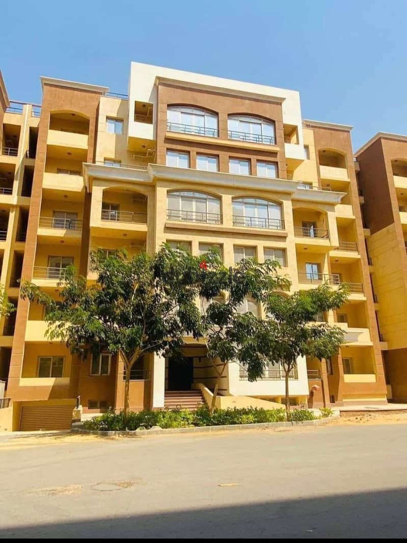 An apartment in the best tourist walk buildings in the new administrative capital in Al-Maqsad, the most luxurious compound at the old price 1