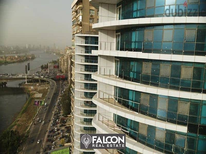 Own now a hotel apartment managed by Hilton ((immediate delivery)) with a direct view of the Nile and full hotel services, Nile Pearl Towers 2