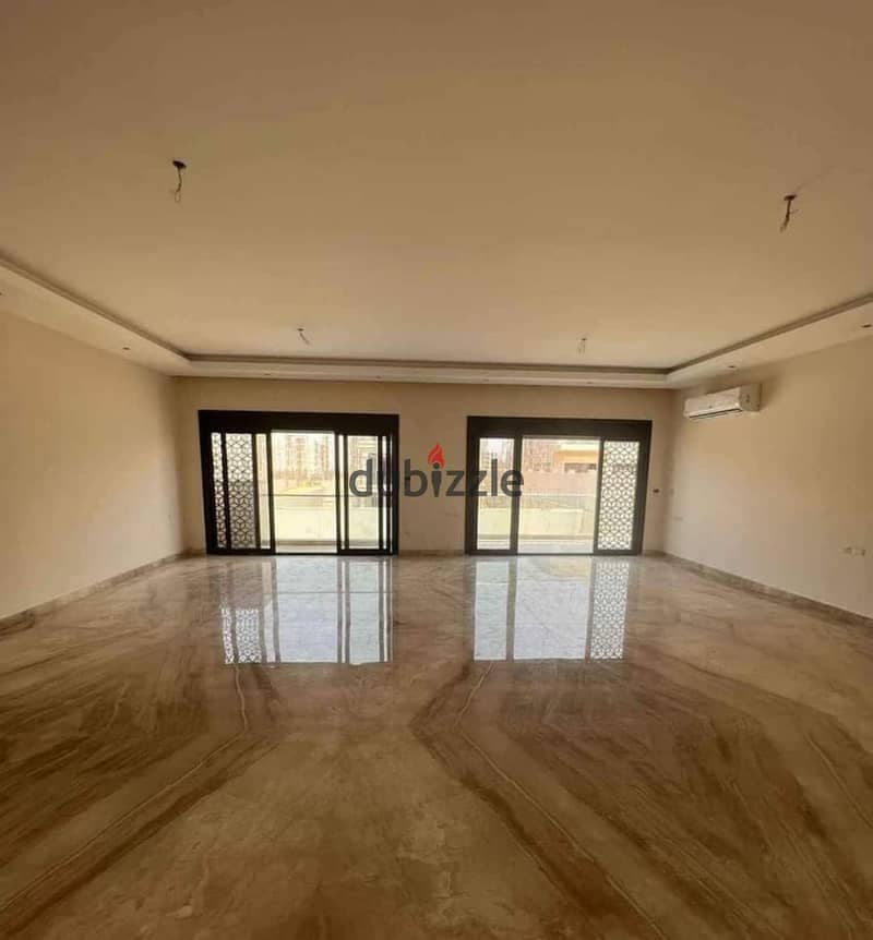 Prime location apartment with 4 rooms in Owest, available for installment over 9 years, directly across from Mall of Egypt. 31