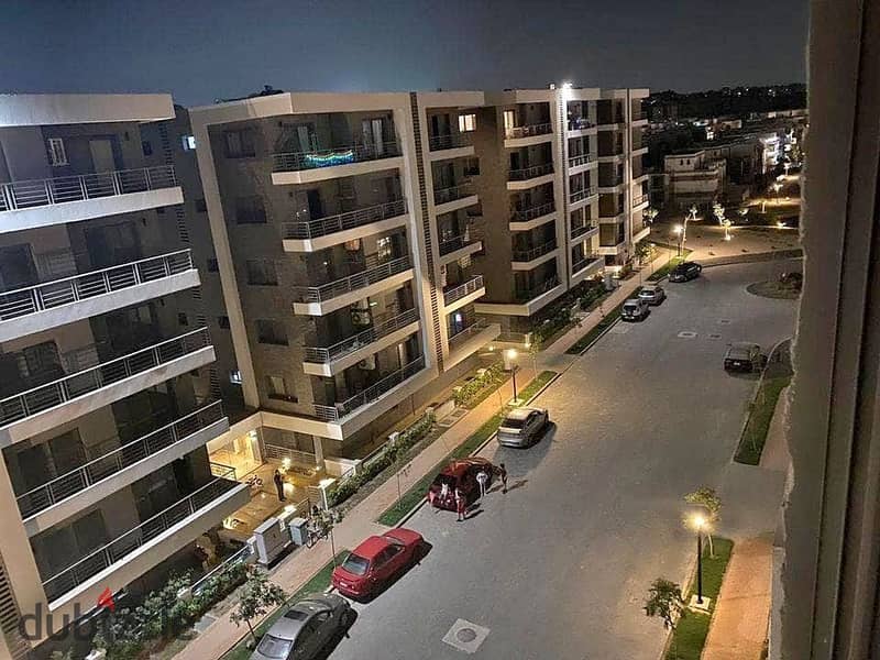 Luxurious apartment for sale, 156 square meters, with 3 bedrooms and a very distinctive view overlooking the landscape, located in front of Cairo Inte 3