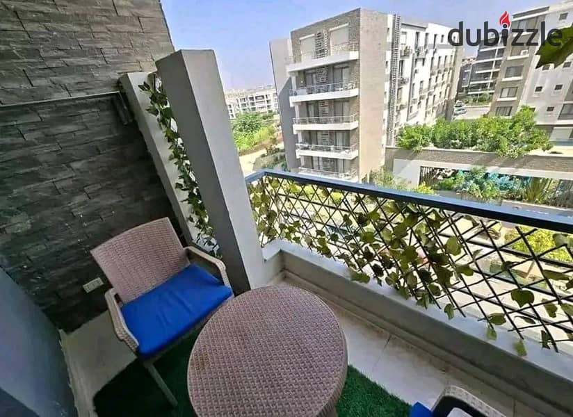 For sale, the last two-bedroom apartment, 130 m, in Taj City Compound, in front of Cairo Airport, with installments over 8 years 1