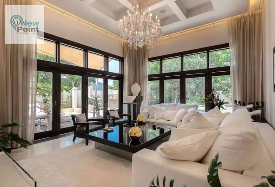 Prime location apartment with a very special view, fully finished, for sale in the most luxurious and highest compounds in New Cairo, Swan Lake Hassan 1