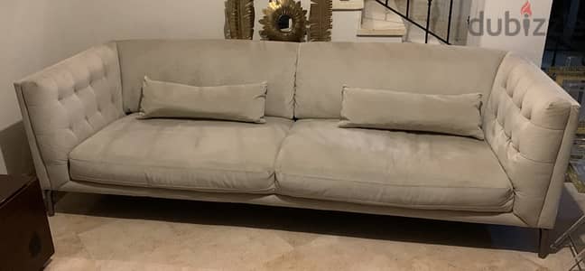 Light grey couch w/ matching pillows and loveseat