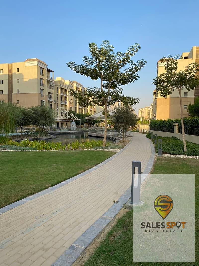 Half price, own an apartment with a private garden for sale (3 rooms) at the lowest price in Sarai Compound, all overlooking the Fifth Settlement, min 9