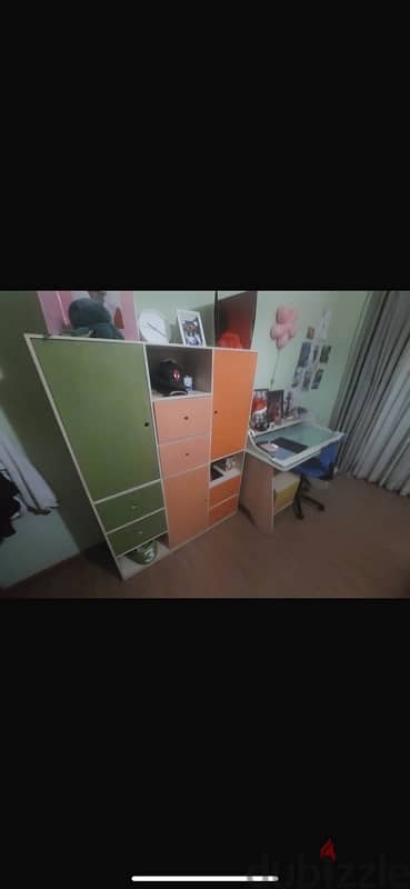 Teenage full bedroom with a pallet of green pink orange and blue 11