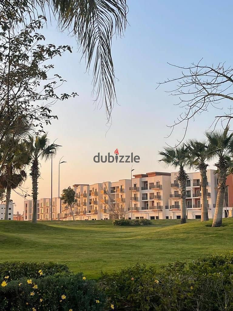 Own a 886-meter villa with a landscape view in installments over 7 years in Sheikh Zayed from Nyoum next to Mountain View 15