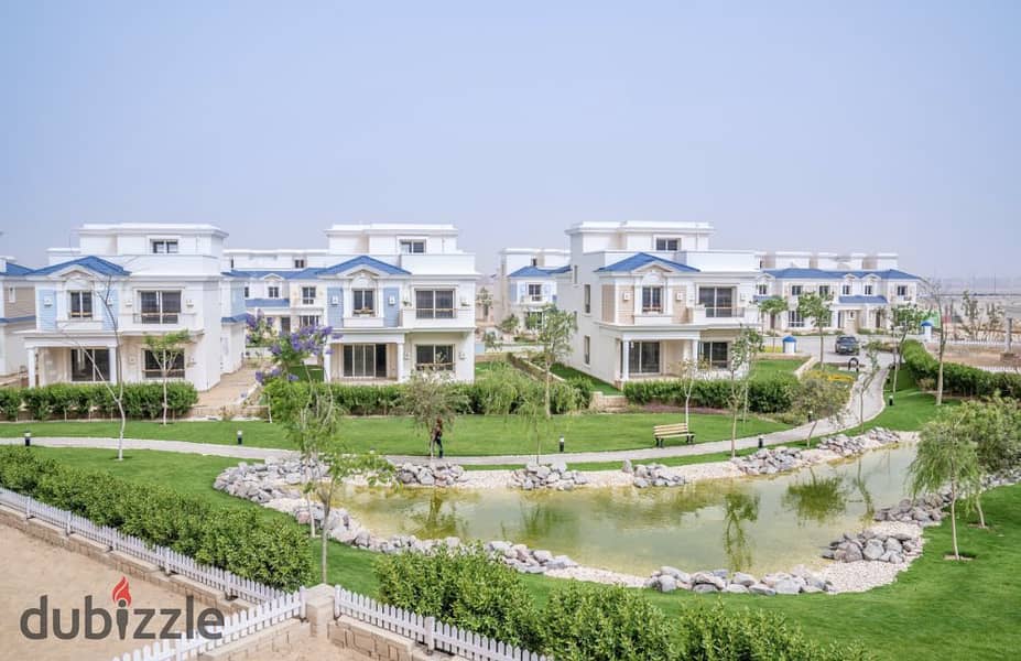 Townhouse villa with a direct view of the lagoon in the northern expansions, minutes from Sheikh Zayed, behind Mall of Arabia, Jehan Square 6