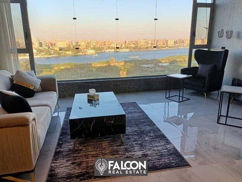 For sale, a hotel apartment overlooking the Nile, immediate delivery, fully finished (air conditioners + appliances) in Maadi, in the Reve Du Nil proj 1