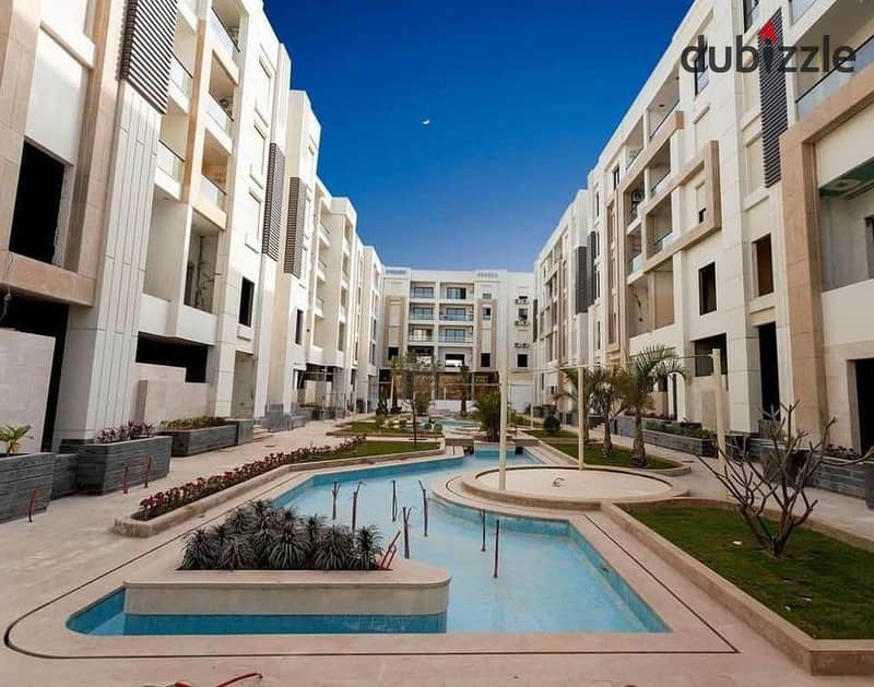 3-room finished apartment with air conditioning and kitchen for sale in front of City Center Almaza, Valore. 1