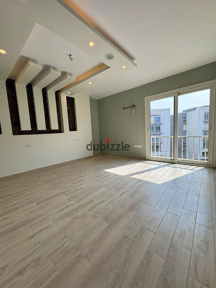 3-room finished apartment with air conditioning and kitchen for sale in front of City Center Almaza, Valore. 3