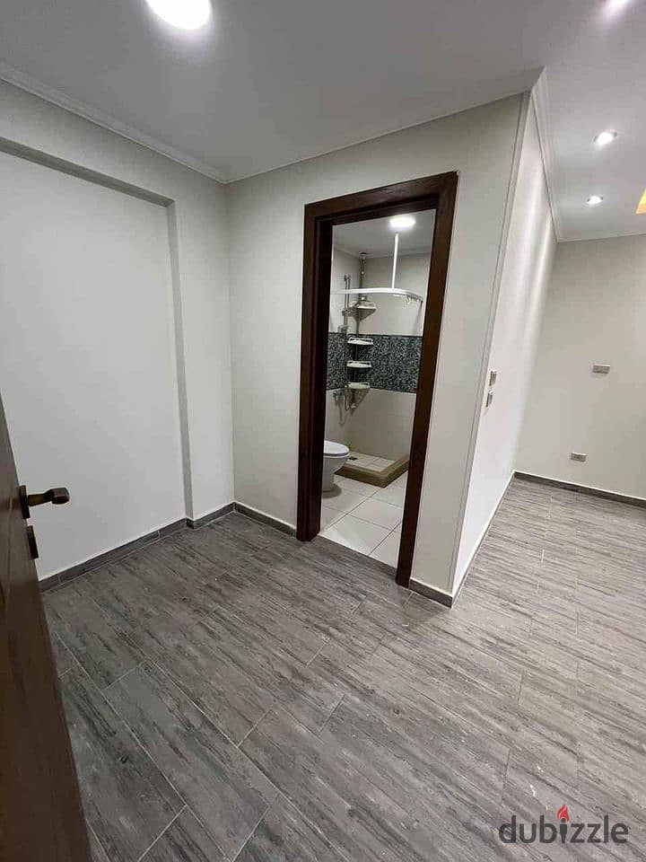 3-room finished apartment with air conditioning and kitchen for sale in front of City Center Almaza, Valore. 6