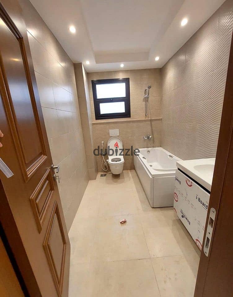 3-room finished apartment with air conditioning and kitchen for sale in front of City Center Almaza, Valore. 7