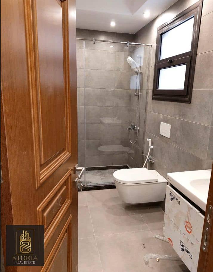 A finished apartment with air conditioners and a kitchen for sale in installments in the heart of the Sheraton, next to Almaza City Center and a minut 4