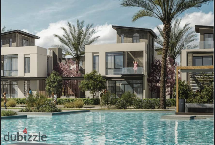 Live in a 3-storey villa with a landscape view, in installments over 9 years, in a prime location in Sheikh Zayed 2