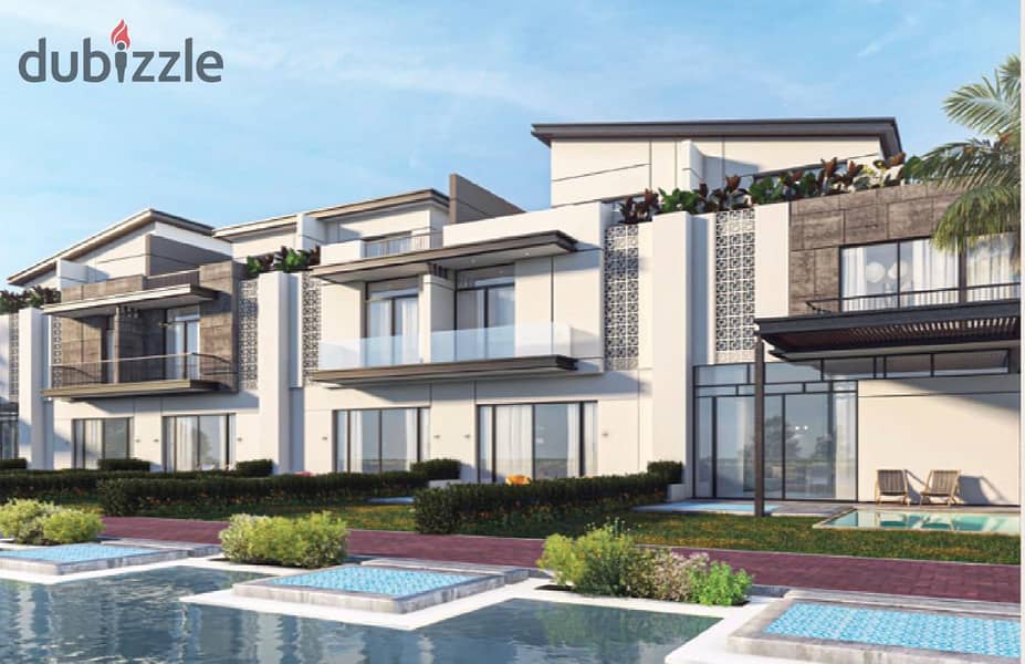 Live in a 3-storey villa with a landscape view, in installments over 9 years, in a prime location in Sheikh Zayed 8