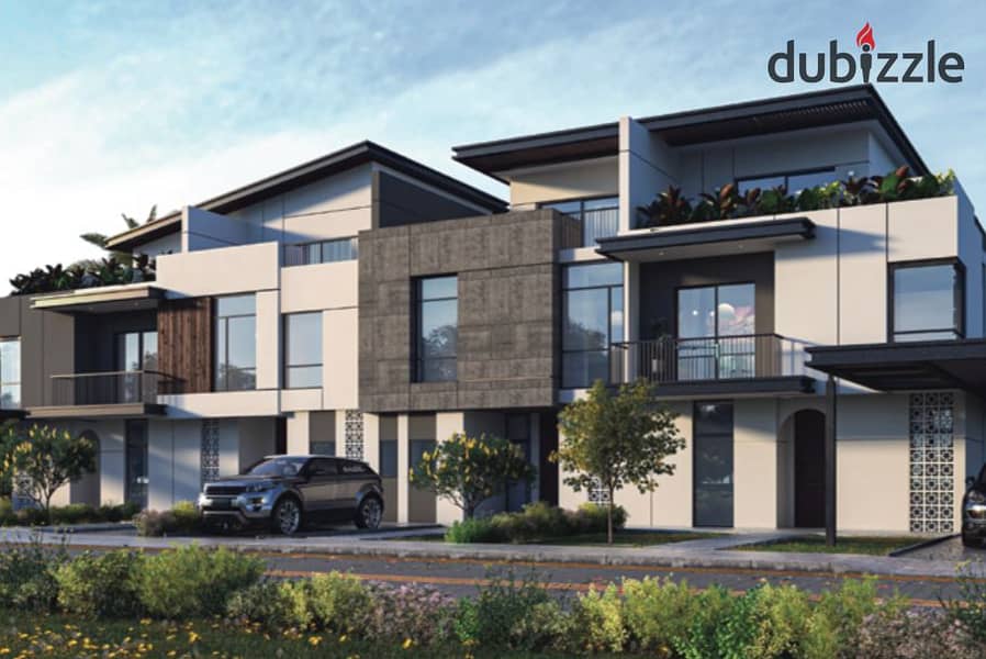 Live in a 3-storey villa with a landscape view, in installments over 9 years, in a prime location in Sheikh Zayed 14