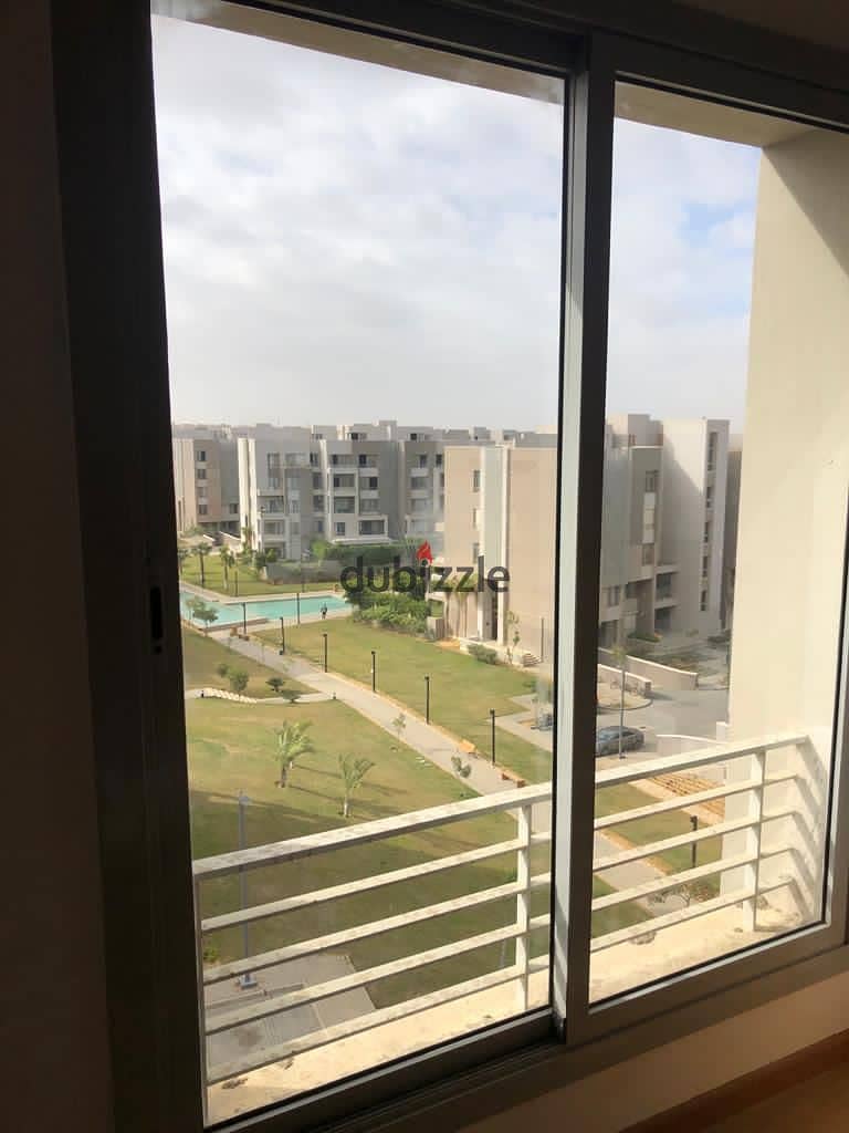 apartment in vgk compound palm hills for rent with kitchen and AC'S view pool and landscape new cairo 1