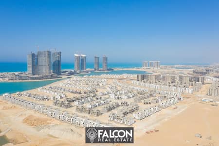 For sale, a chalet with a panoramic view on Al Alamein Towers and the sea, in the most distinguished village in the heart of the coast, MAZARIN, in in