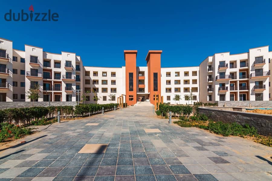 Twin house behind Mall of Arabia at a great price with a fantastic view in Nyoum compound. 9