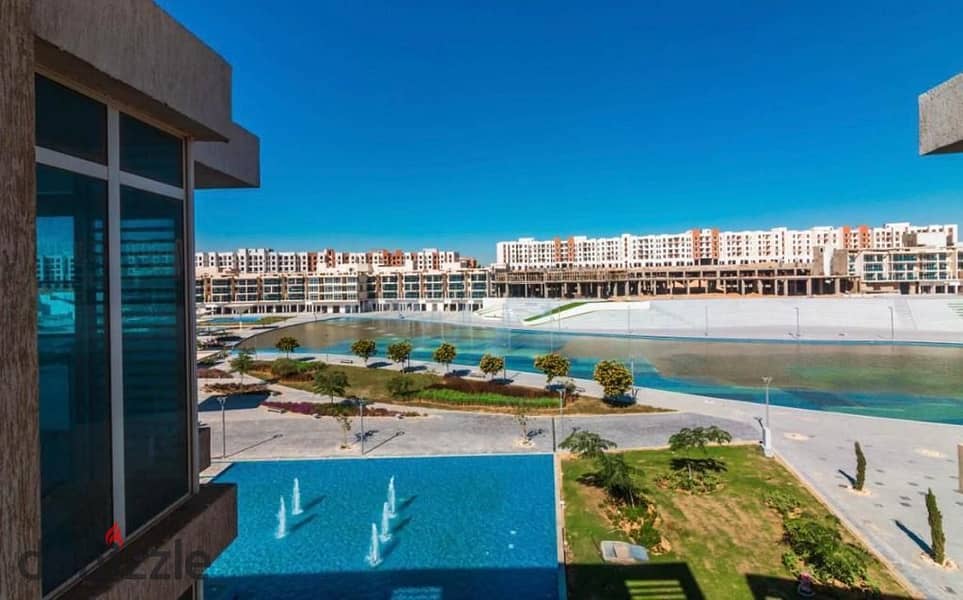 Twin house behind Mall of Arabia at a great price with a fantastic view in Nyoum compound. 10