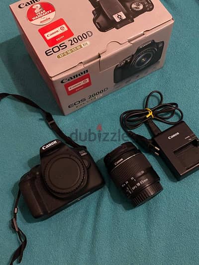 Canon EOS 2000D with zoom lens EF-S 18-55mm kit lens