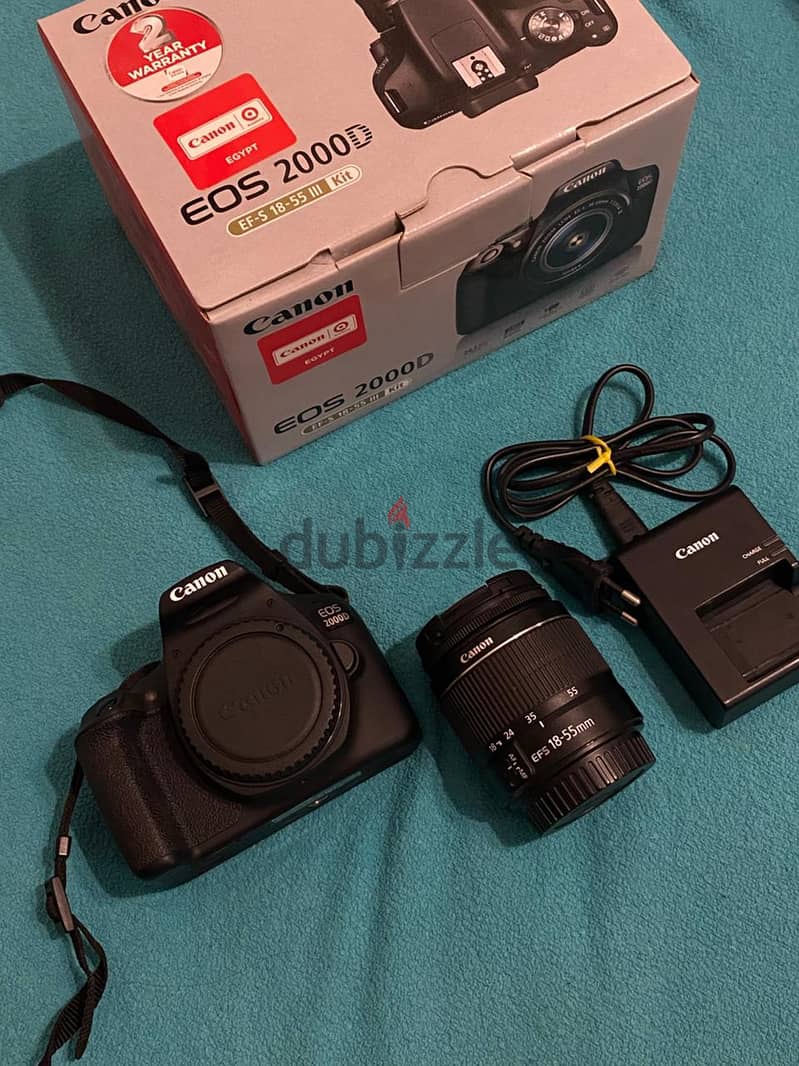 Canon EOS 2000D with zoom lens EF-S 18-55mm kit lens 0