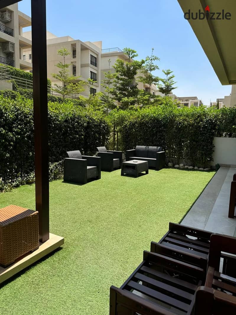 apartment with garden for sale in Fifth square - AlMarasem  ( Kitchen + air conditioners + dressing ) New Cairo - Fifth Settlement 1