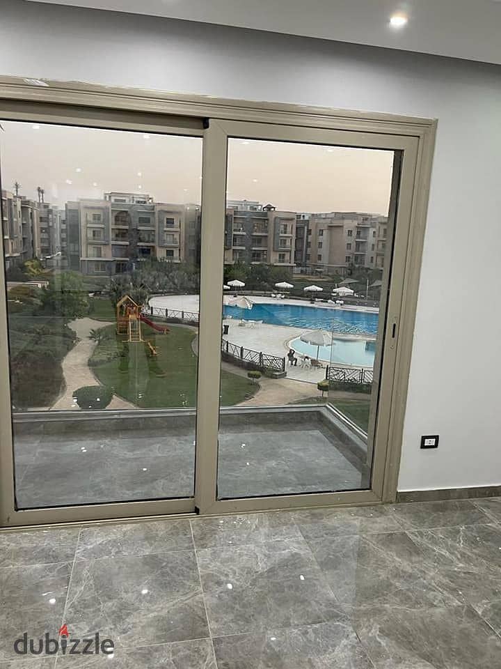 apartment with garden for sale ( ready to move & fully finished ) in galleria moon valley compound , golden square , 5th settlements 1