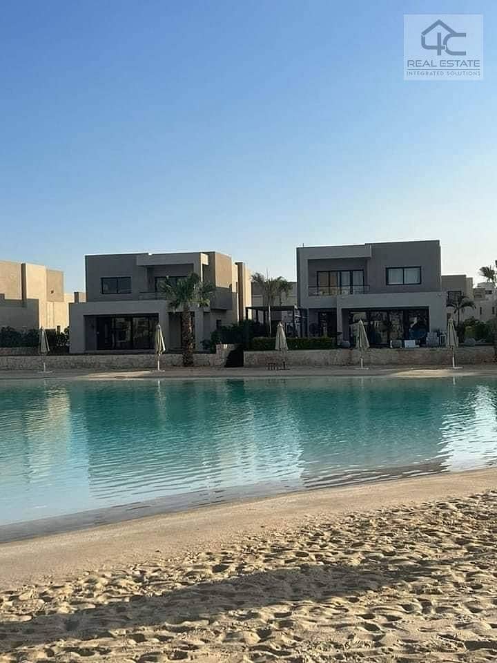 WITH the lowest price in Azha, own a finished duplex with AC and a kitchen,  double view on the largest Crystal Lagoon and directly to the sea 20