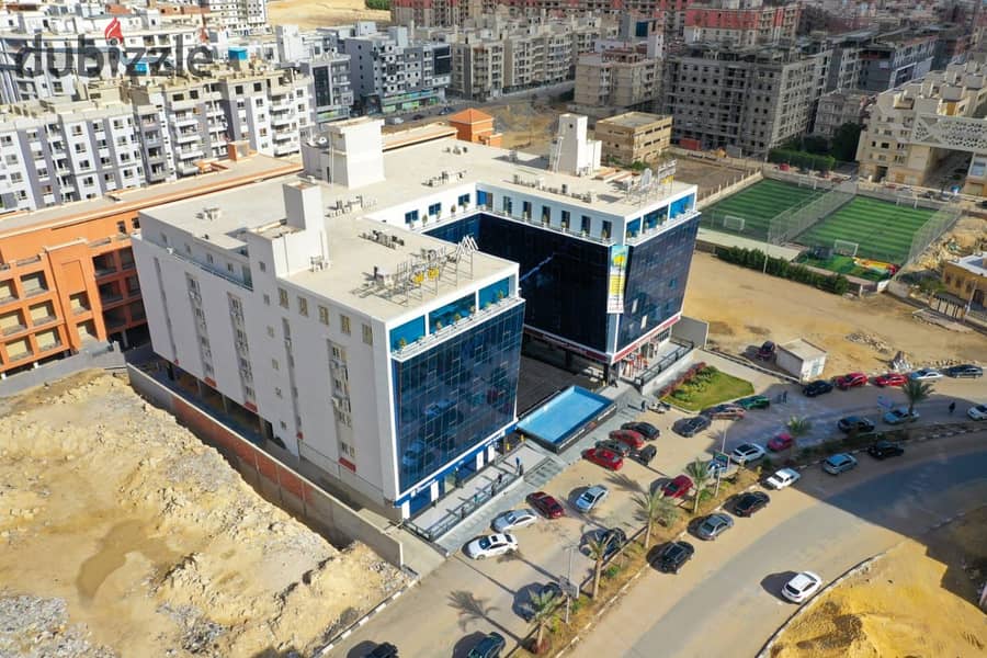 Exclusive analysis laboratory for rent, 113 meters, finished, view on the front of a mall in Mokattam 5