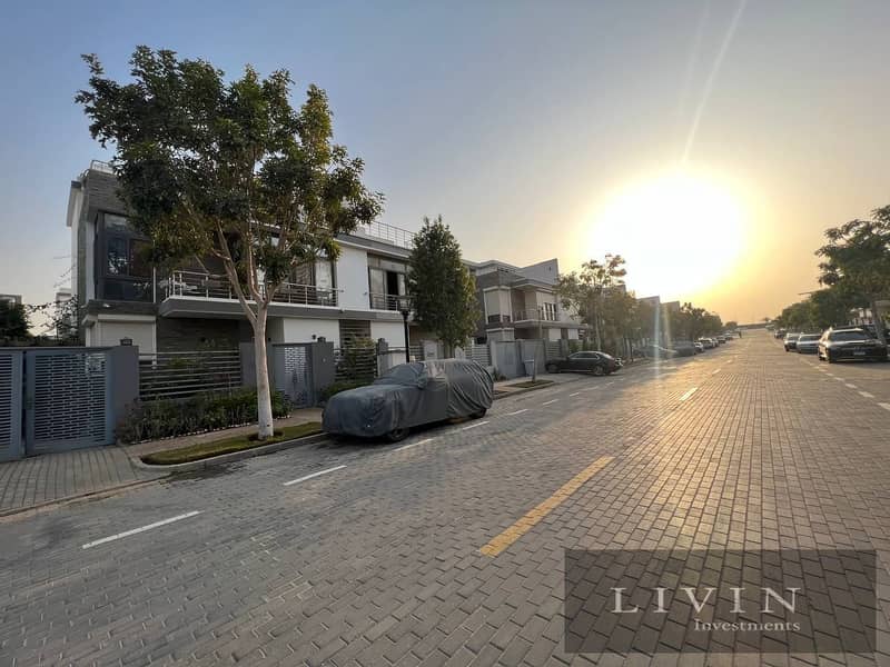 Garden duplex villa for sale, large area, 4 rooms + 175 m garden, landscape view, in installments over the longest payment period, Taj City new cairo 3