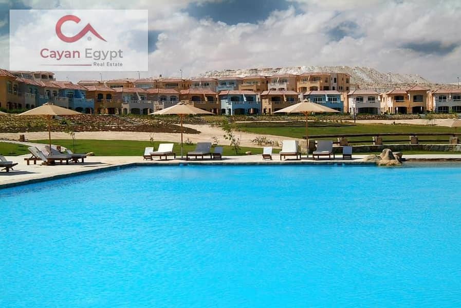 A fully finished chalet in the best location in Telal El Sokhna, on the lagoon and with a sea view, with a down payment of 450k, in installments over 5