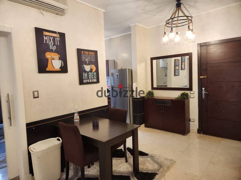 Furnished studio with garden rent Village Gate Palm Hills New Cairo 2