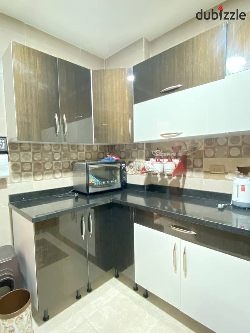 For rent furnished apartment in Dokki Al-Masaha Square modern furniture fully ac’s ninth floor for long periods only 7