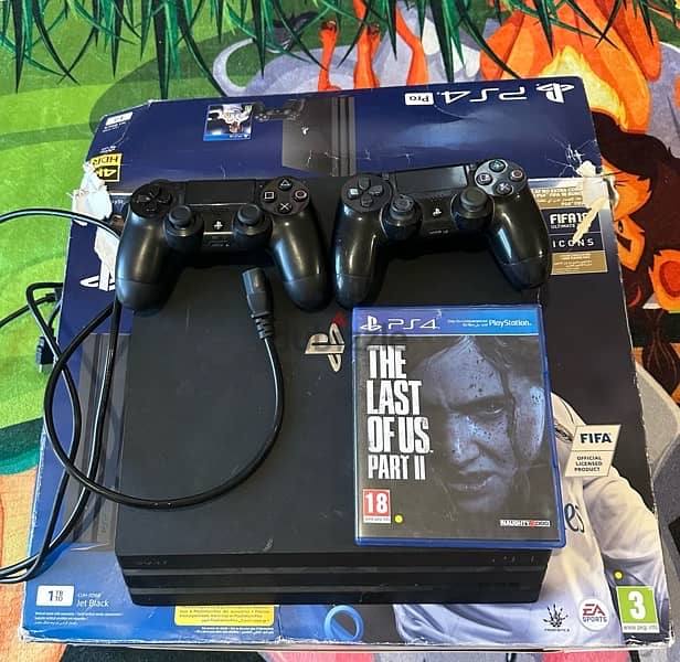 ps4 pro 1 TB with 2 controllers and original box for sale 1