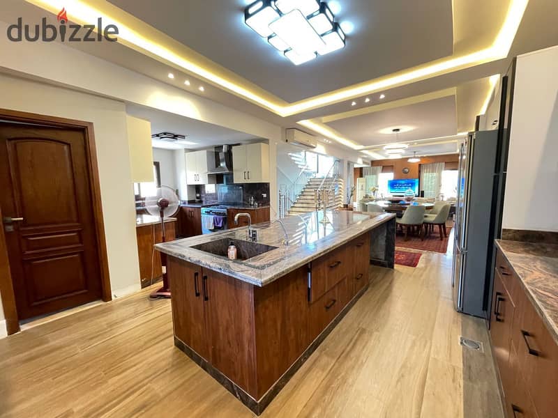 luxurious twin house in sheikh zayed offers a modern design, ideal for a large family seeking comfort and high-end amenities in a prime location 20