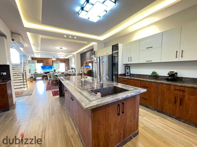 luxurious twin house in sheikh zayed offers a modern design, ideal for a large family seeking comfort and high-end amenities in a prime location 21