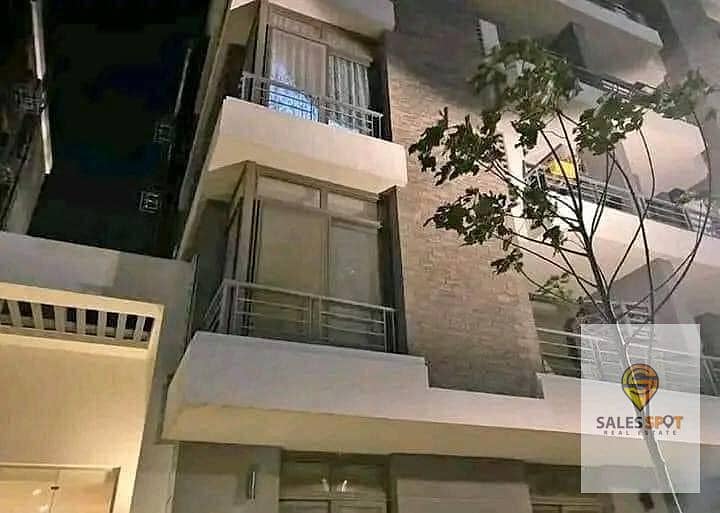 A distinctive garden apartment for sale in Taj City compound, near Nasr City 9