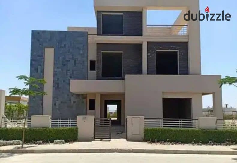 Twin house for sale in the heart of Sheikh Zayed, Alkarma Vaha compound, available for installment payments. 9