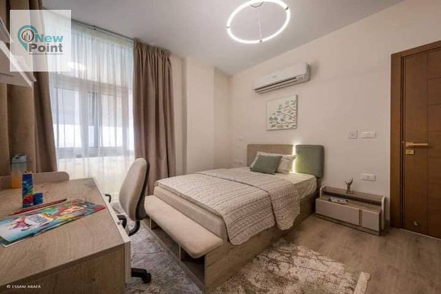 Two-room apartment with 10% down payment in front of Cairo International Airport in Taj City New Cairo Compound 4