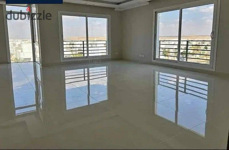 At the lowest price in Sheikh Zayed, a townhouse for sale with a very special view in Vye Sodic Compound 2