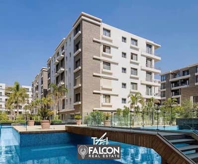 The lowest price for a two-bedroom apartment in the best location on the Suez Road in Taj City, New Cairo, in front of the airport