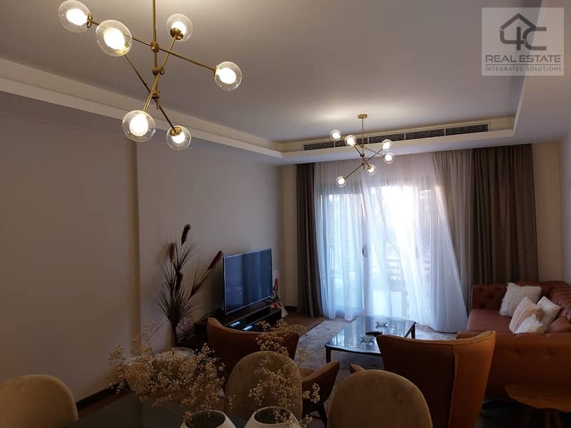 Apartment in garden for sale, finished and furnished, with air conditioners appliances and kitchen 138 sqm, Ready to move at less than the market pric 9