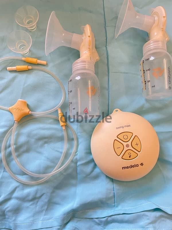 مجموعه الرضاعه الطبيعيه شفاطmedela+برا لشفاط+فلانج+اكياس تخزين لبن+قطن 4