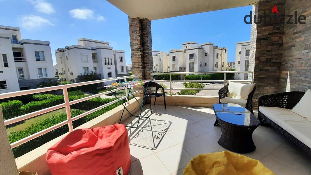 A distinctive chalet in Amwaj Sidi Abdel Rahman on the North Coast, with a view of a garden on one side and a swimming pool on the other, at a very go 0