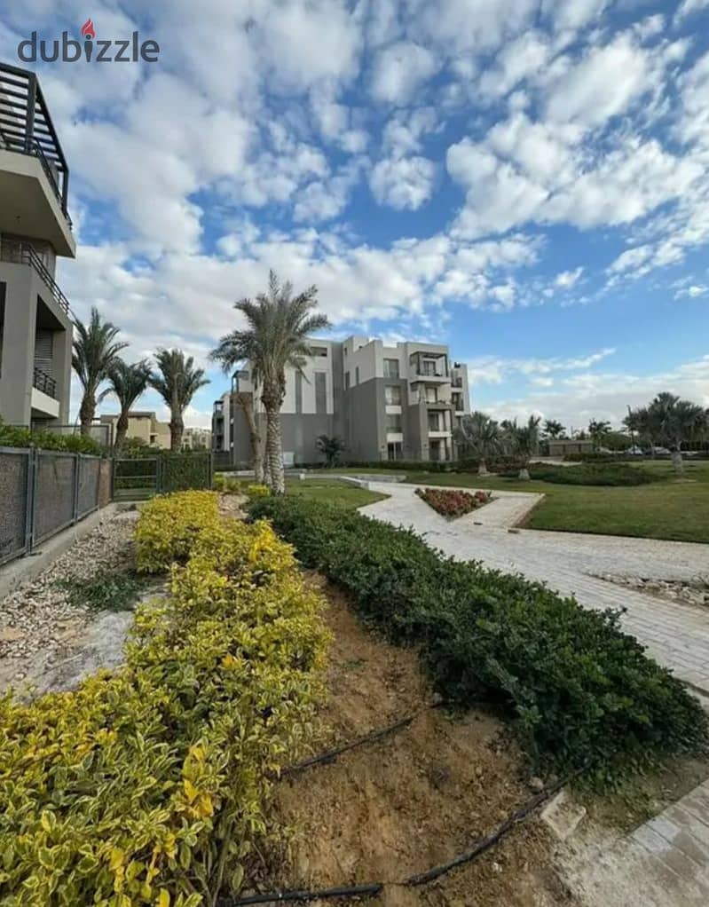 Apartment in a garden, fully finished, in Palm Hills compound, Palm Parks, in front of Arkan Plaza, available for installment payment. 8