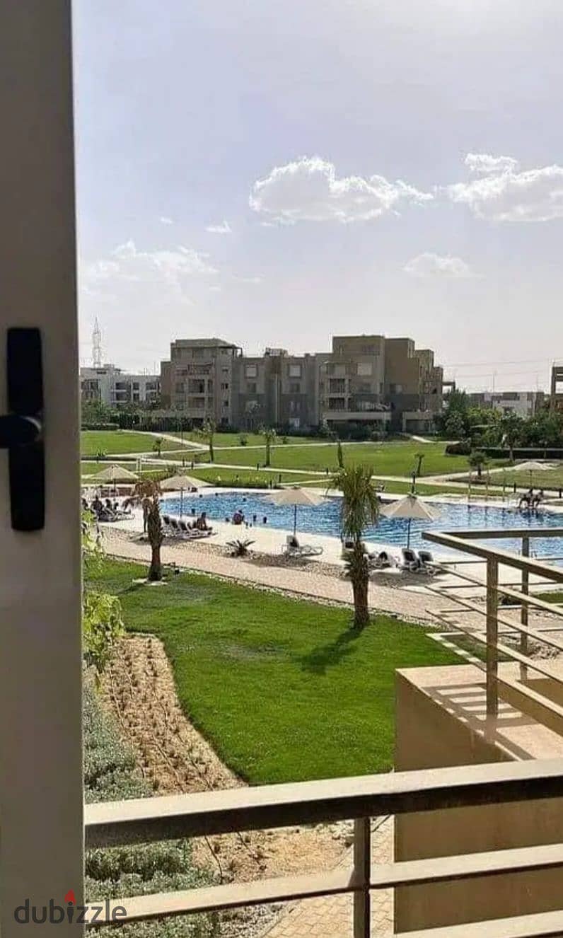 Apartment in a garden, fully finished, in Palm Hills compound, Palm Parks, in front of Arkan Plaza, available for installment payment. 9