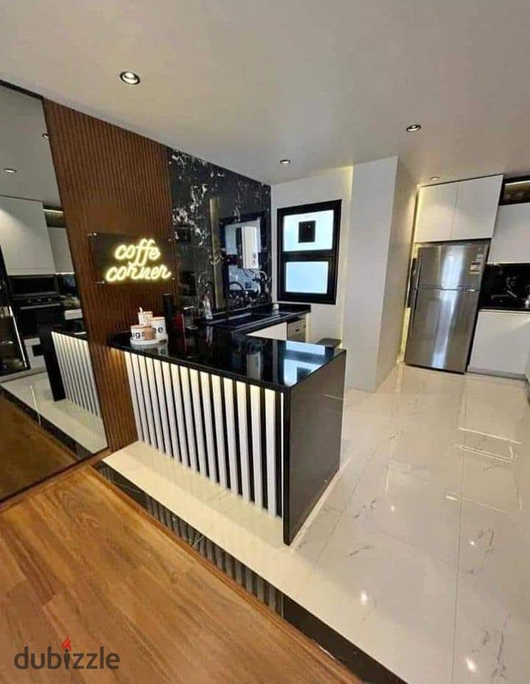 Apartment for sale in installments, fully finished, with a private garden, in a very special location in the Ninety Avenue Compound, Fifth Settlement 3