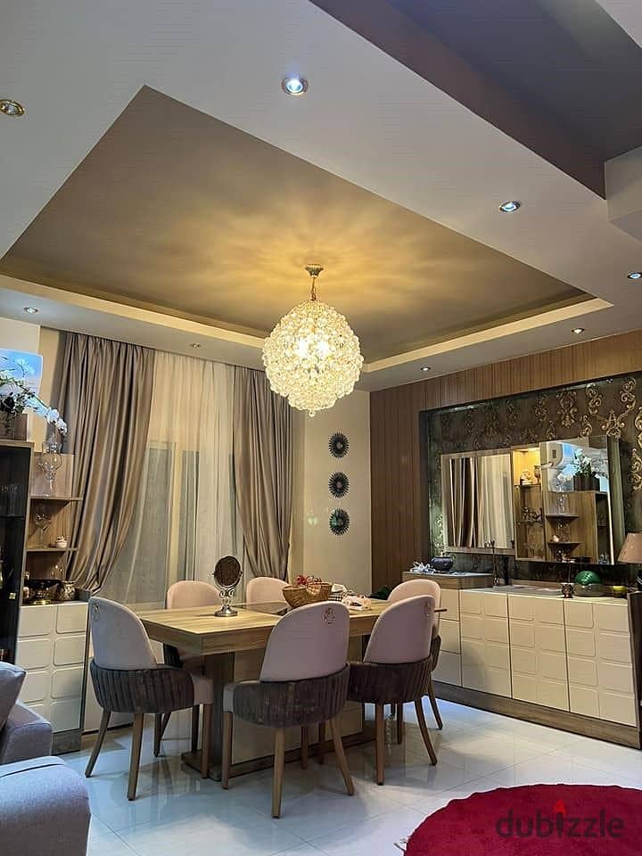 Apartment for sale in installments, fully finished, with a private garden, in a very special location in the Ninety Avenue Compound, Fifth Settlement 4